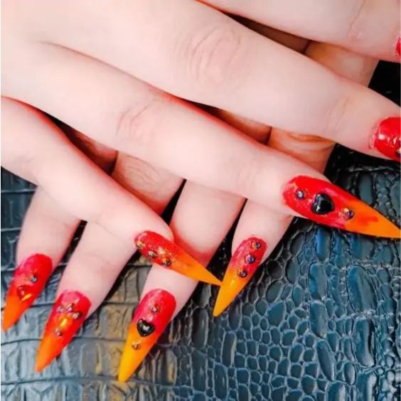 Blaze-Colored Nails With Diamonds