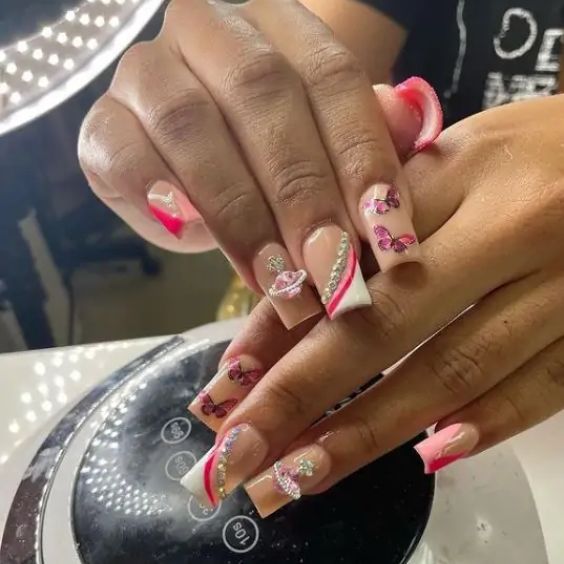 Butterfly-Themed Nude Acrylic Diamond Nails